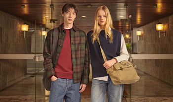 A.P.C. Women Sale Blouses, Shirts - Woman and man standing wearing collegiate clothing.