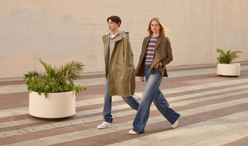 A.P.C. Men Sale Jeans - Woman and man walking together on school campus.