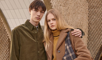 A.P.C. Men Sale Pants, Shorts - Woman and man standing together in fall clothing.