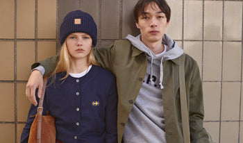 A.P.C. Women Sale View All - Woman and man standing together in collegiate clothing.