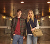 A.P.C. Sale - Woman and man standing in front of University doors wearing collegiate style clothing.