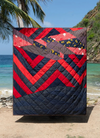 A.P.C. Quilts Round 25 - quilt hanged on a beach