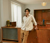 A.P.C. Men's New Arrivals - man model in Spring attire in a kitchen interior