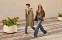 A.P.C. Fall/Winter Campaign - Man and woman walking on stone tiles wearing collegiate clothing.