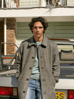 A.P.C. The Brand - Man wearing plaid wool jacket and jeans standing in front of car