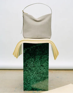 A.P.C. Fall/Winter Campaign - Ecru Vera bag on Jade-like stone stand.