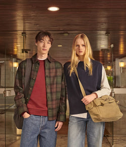 A.P.C. Fall/Winter Campaign - Man and woman standing together wearing collegiate clothing.